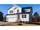 Two-story house with gray siding, white trim, and a two-car garage at 395 Fast Pitch Ln, Four Oaks, NC 27524