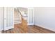 Office with hardwood floors, French doors, and a view of the stairs and kitchen at 395 Fast Pitch Ln, Four Oaks, NC 27524