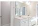 Double vanity bathroom with marble shower and modern fixtures at 411 Fast Pitch Ln, Four Oaks, NC 27524