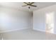 Bright bedroom with ceiling fan and en-suite bathroom access at 411 Fast Pitch Ln, Four Oaks, NC 27524
