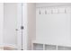Entryway with bench, cubbies, and coat hooks at 411 Fast Pitch Ln, Four Oaks, NC 27524