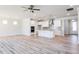 Modern kitchen with white cabinets, large island, and stainless steel appliances at 411 Fast Pitch Ln, Four Oaks, NC 27524