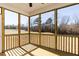 Spacious screened porch overlooking the backyard at 411 Fast Pitch Ln, Four Oaks, NC 27524