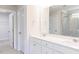 Modern bathroom with double sink vanity, a large mirror, and stylish fixtures at 427 Fast Pitch Ln, Four Oaks, NC 27524