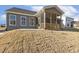 A cozy screened-in back porch with an adjacent patio offers a relaxing outdoor space at 52 Gander Dr, Benson, NC 27504