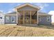 A covered back porch with wood framing overlooks the yard at 52 Gander Dr, Benson, NC 27504