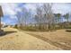 Vast, grassy backyard leading to a line of mature trees at 52 Gander Dr, Benson, NC 27504