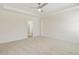 Spacious bedroom with neutral carpet, ceiling fan and ensuite bathroom access at 52 Gander Dr, Benson, NC 27504