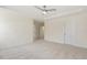 Expansive bedroom with ceiling fan and neutral carpeting with attached bathroom and walk-in closet at 52 Gander Dr, Benson, NC 27504