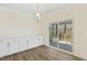 Dining area with wood floors, built-in cabinets, and sliding glass doors to the screened porch, offering peaceful meals at 52 Gander Dr, Benson, NC 27504
