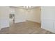 Spacious dining area boasts wood-look floors, modern lighting, and open access to the kitchen, great for gatherings at 52 Gander Dr, Benson, NC 27504