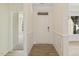 Light-filled foyer features white trim, light wood-look flooring, and a view into the home at 52 Gander Dr, Benson, NC 27504