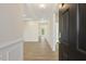 Open foyer with light wood floors, white trim, and access to the living spaces of the home at 52 Gander Dr, Benson, NC 27504