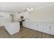 Modern kitchen with white cabinets, a large island, stainless appliances, and an open layout at 52 Gander Dr, Benson, NC 27504