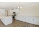 Bright kitchen with stainless steel appliances, sleek countertops, and modern lighting, designed for culinary enthusiasts at 52 Gander Dr, Benson, NC 27504