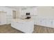 Spacious kitchen with modern appliances, white cabinets, and a large island, perfect for cooking and entertaining at 52 Gander Dr, Benson, NC 27504