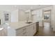 Open kitchen with a large island, stainless steel appliances, and sleek cabinetry, creating a culinary haven at 52 Gander Dr, Benson, NC 27504