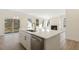 Modern kitchen features a large island, stainless steel appliances, and a seamless flow to the living spaces at 52 Gander Dr, Benson, NC 27504