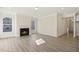Spacious living room showcasing a fireplace with light wood-style flooring at 52 Gander Dr, Benson, NC 27504