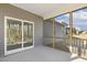 Spacious screened porch with gray siding and a sliding glass door to the house at 52 Gander Dr, Benson, NC 27504