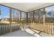 Inviting screened porch with views of the surrounding trees and neighborhood at 52 Gander Dr, Benson, NC 27504
