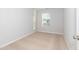 Clean bedroom with neutral carpeting and a bright window at 565 Marthas View Way, Wake Forest, NC 27587
