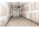 Unfinished garage featuring concrete floors, white walls and an insulated garage door at 565 Marthas View Way, Wake Forest, NC 27587