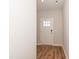 Entryway featuring hardwood floors and a white front door at 565 Marthas View Way, Wake Forest, NC 27587