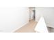 Upstairs hallway featuring neutral carpeting and a view of an open doorway at 565 Marthas View Way, Wake Forest, NC 27587