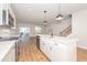 Bright kitchen with stainless steel appliances and island with seating at 565 Marthas View Way, Wake Forest, NC 27587
