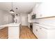 Bright kitchen featuring stainless steel appliances, white cabinetry, and island at 565 Marthas View Way, Wake Forest, NC 27587