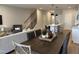 Open concept living area with dining table, kitchen island and living room at 565 Marthas View Way, Wake Forest, NC 27587