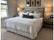 Comfortable bedroom with a king-size bed, two bedside tables, and a window at 565 Marthas View Way, Wake Forest, NC 27587