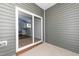 A neutral patio with access to the yard through a sliding glass door at 565 Marthas View Way, Wake Forest, NC 27587