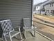 Relaxing porch with rocking chairs overlooking the yard and neighboring homes at 565 Marthas View Way, Wake Forest, NC 27587