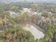 Community aerial view featuring pond with fountain, lush trees, and newly constructed homes at 2909 Frances Marie Ln, Raleigh, NC 27603