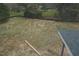 View of the backyard showing grass, trees and fence at 2909 Frances Marie Ln, Raleigh, NC 27603