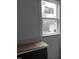 Bathroom featuring a white window, trim, and black vanity at 2909 Frances Marie Ln, Raleigh, NC 27603