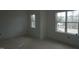 Bedroom featuring pristine white walls, trim and two windows at 2909 Frances Marie Ln, Raleigh, NC 27603