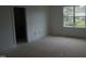 Empty bedroom featuring natural light from the single window at 2909 Frances Marie Ln, Raleigh, NC 27603