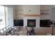 Spacious living room featuring a fireplace, custom built-ins, and natural light at 2909 Frances Marie Ln, Raleigh, NC 27603