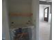 A small, unfinished pantry with shelving and plenty of room for storage at 2909 Frances Marie Ln, Raleigh, NC 27603