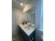 Bathroom featuring a modern vanity with dual sinks and a large mirror at 2728 Princess Tree Dr, Raleigh, NC 27616