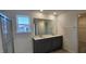 Bathroom featuring dual sinks and a walk-in shower at 2728 Princess Tree Dr, Raleigh, NC 27616
