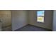 This bedroom showcases neutral walls, a walk-in closet, and a large window at 2728 Princess Tree Dr, Raleigh, NC 27616