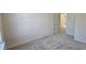 This bedroom features a door leading to another room and plush carpeting at 2728 Princess Tree Dr, Raleigh, NC 27616
