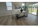 Dining area with a modern table and chairs, illuminated by a stylish chandelier at 2728 Princess Tree Dr, Raleigh, NC 27616