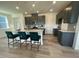 Modern kitchen features an island with seating, stainless steel appliances, and gray cabinets at 2728 Princess Tree Dr, Raleigh, NC 27616