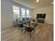 Cozy living room with large windows and comfortable seating arrangement at 2728 Princess Tree Dr, Raleigh, NC 27616