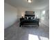 Spacious bedroom with a large bed, stylish lighting, and modern decor at 2728 Princess Tree Dr, Raleigh, NC 27616